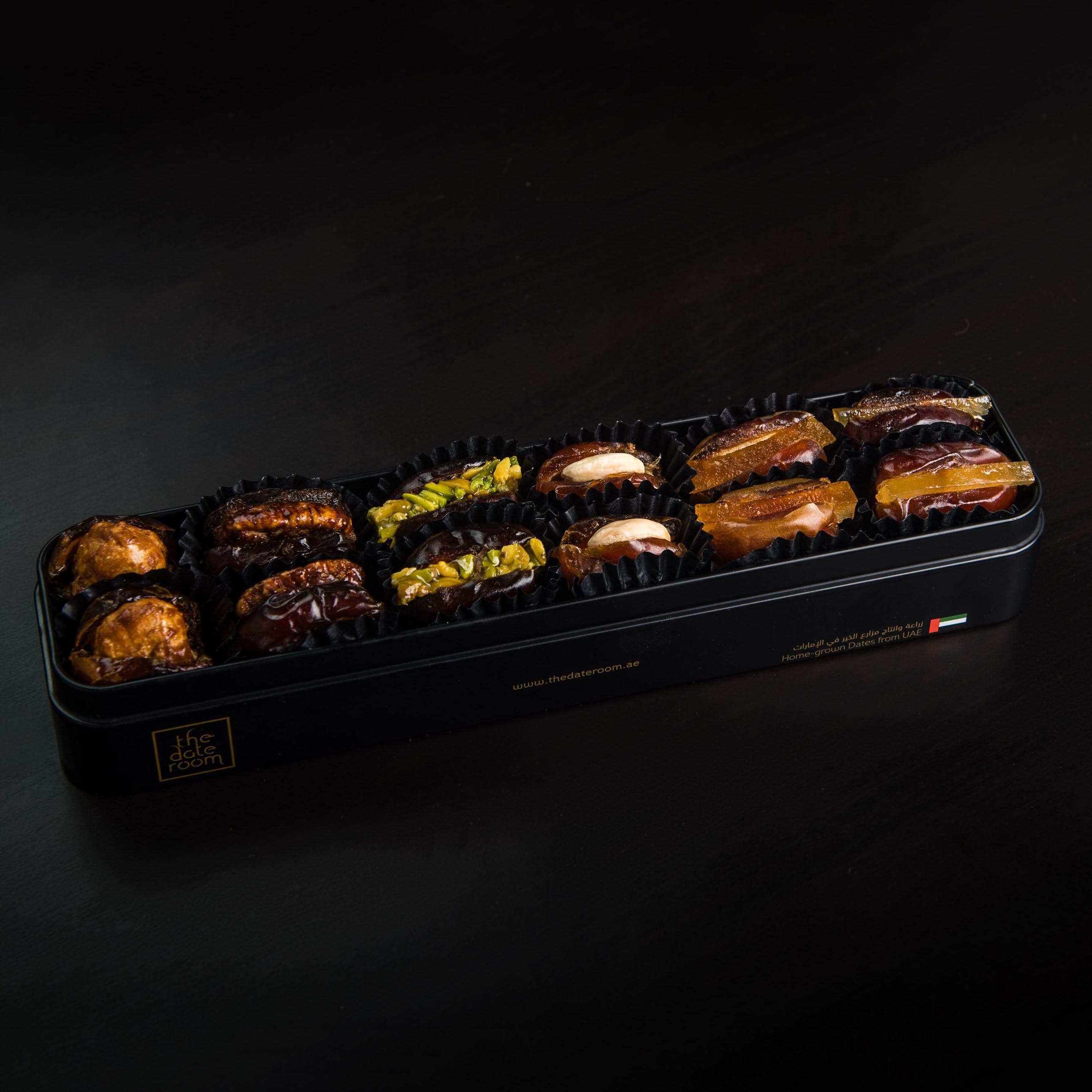 Luxury date gift box open to reveal a curated arrangement of premium Emirati dates