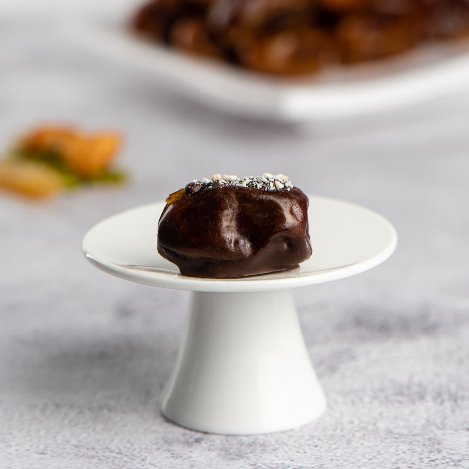 Single-origin chocolate-dipped Khalas dates in a premium presentation box