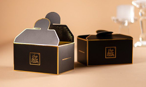 Alt Text: A box of The Date Room's Fardh Dates, celebrated for their striking maroon color and rich flavor.